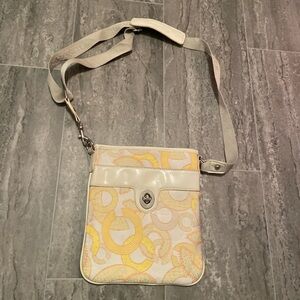 Coach cross body bag with pink inside lining